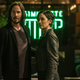 Neo and Triny stand outside a coffee shop in Matrix 4.